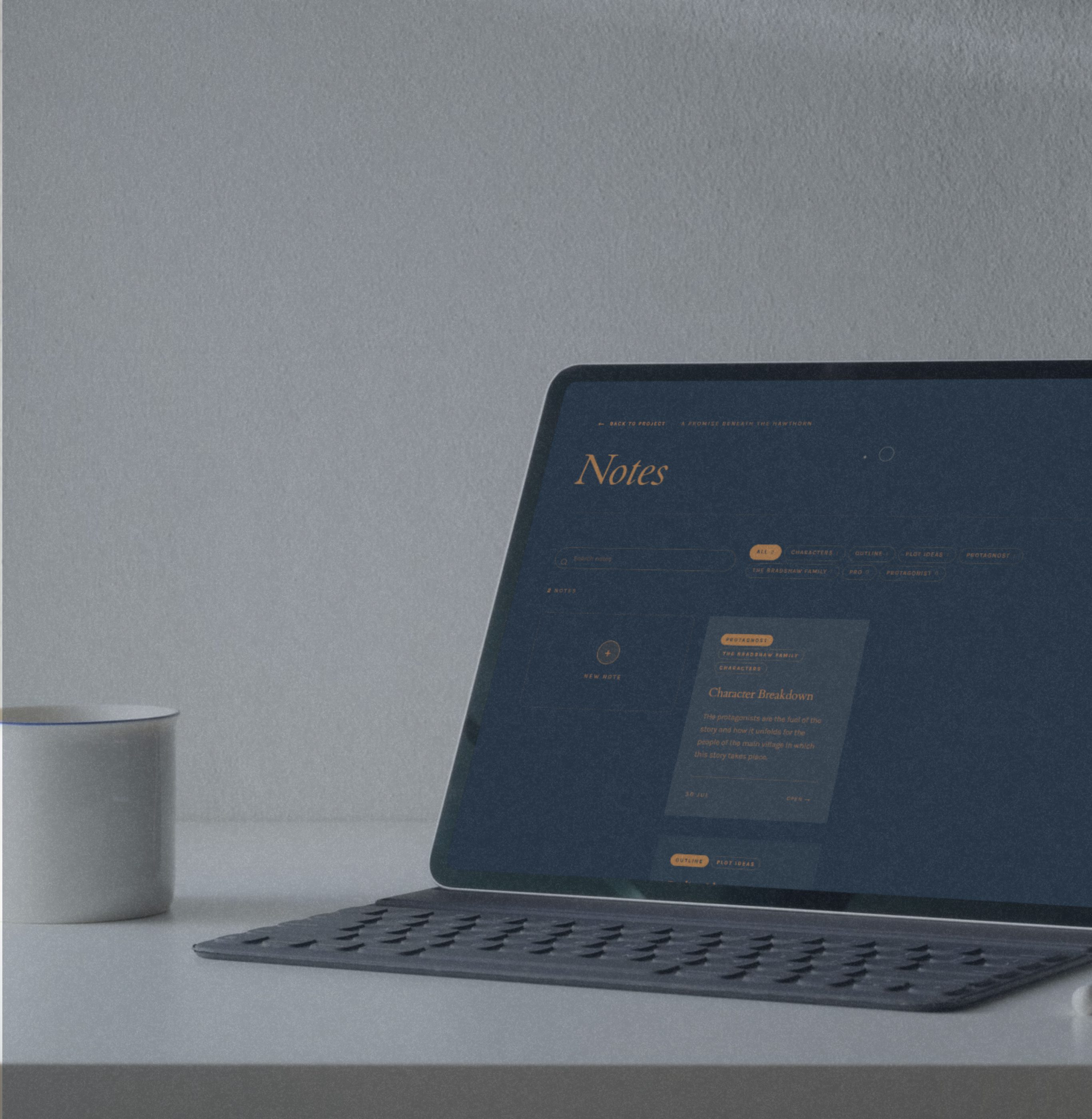 Notes on a laptop, held for the writer