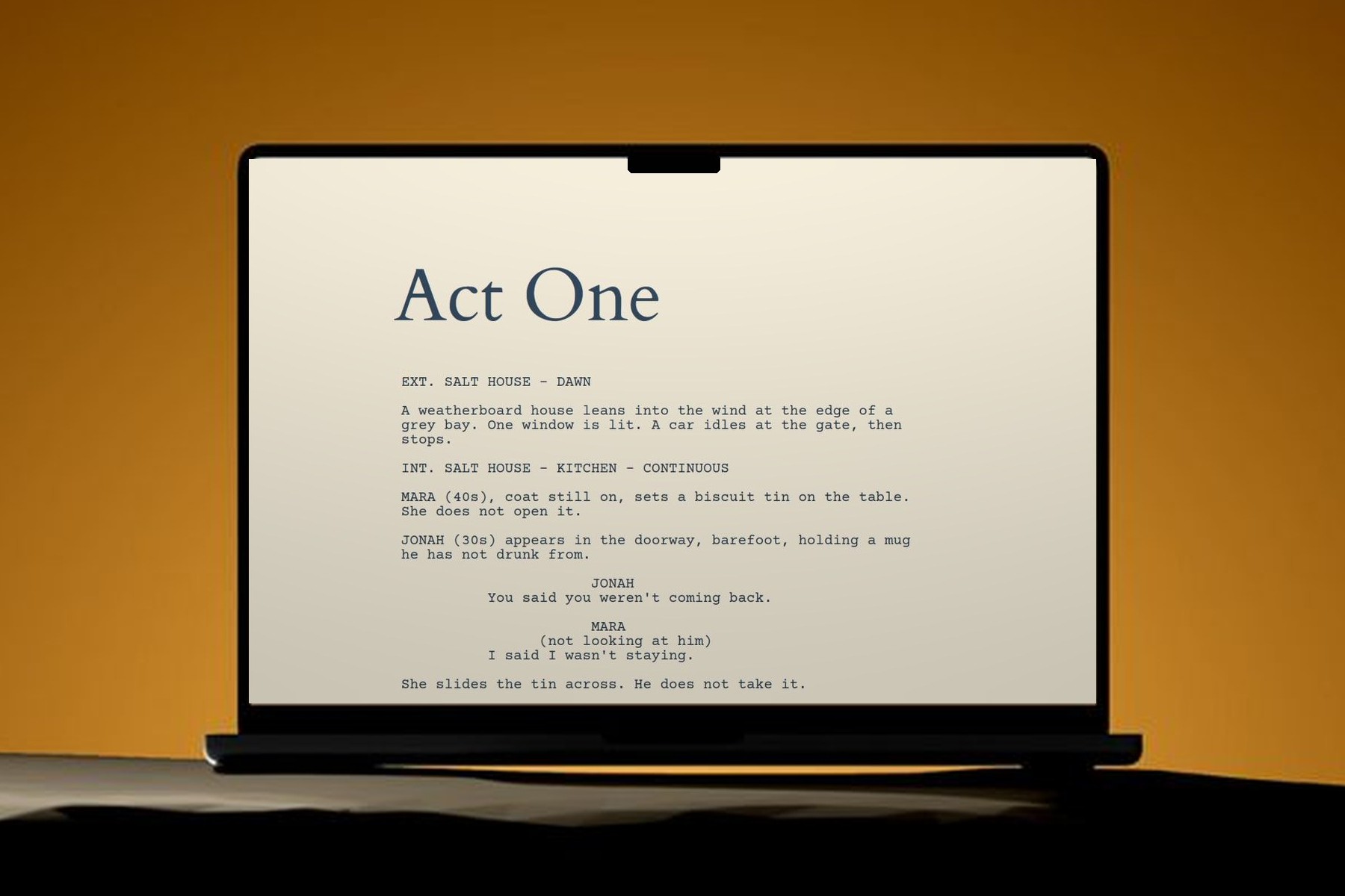 A screenplay open on the Karde script page on a laptop